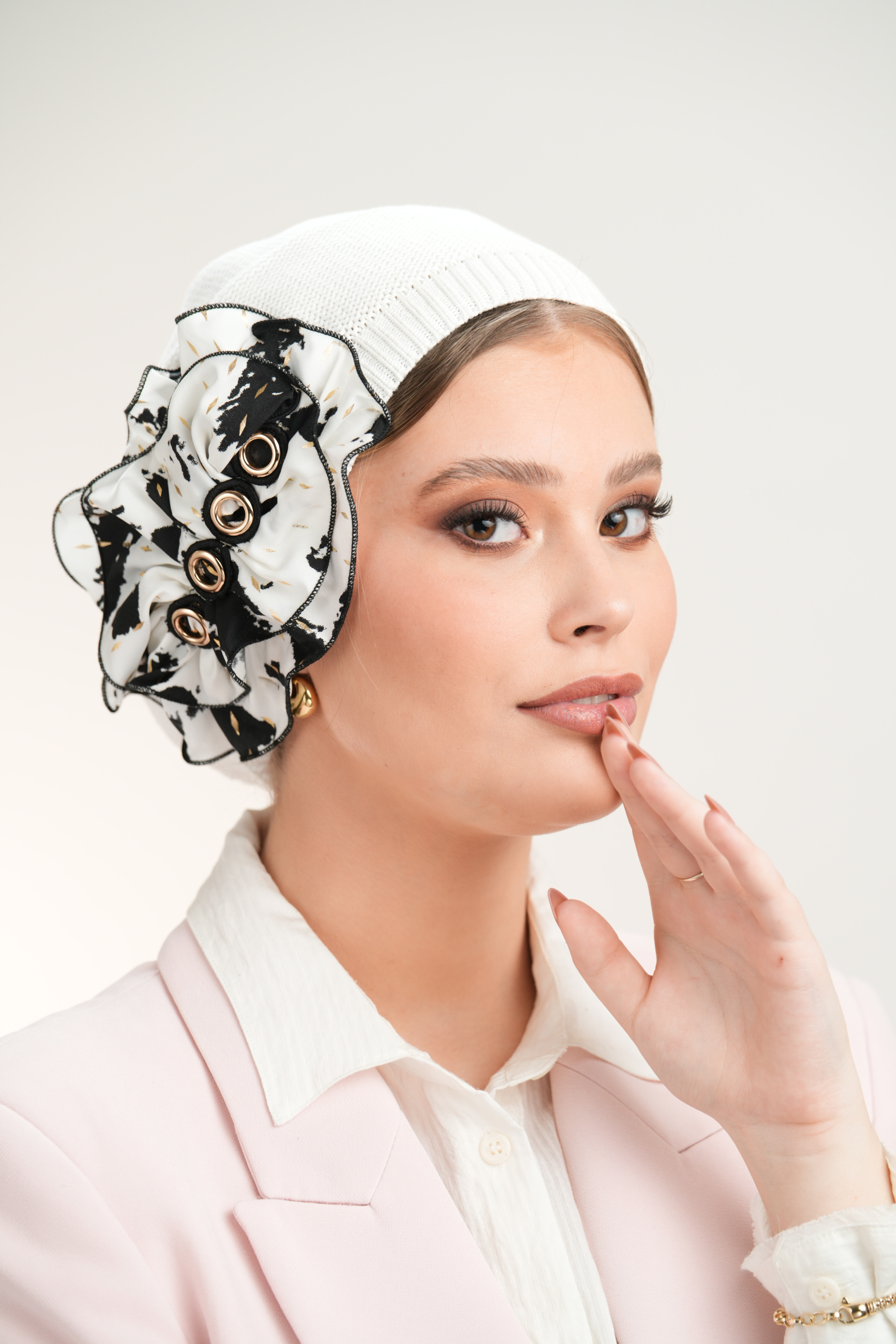 White Beret with black & white flower with gold point and circles