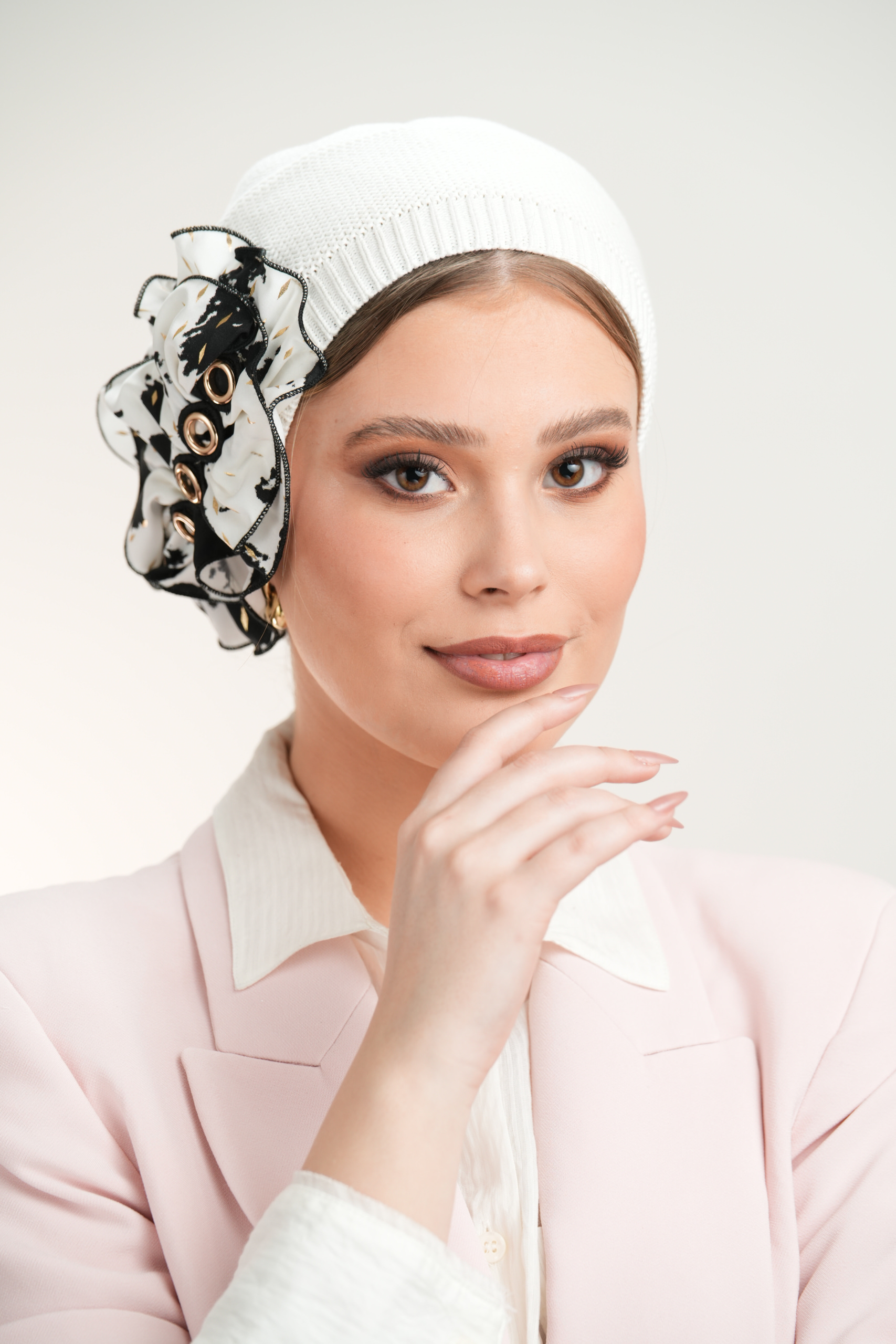 White Beret with black & white flower with gold point and circles